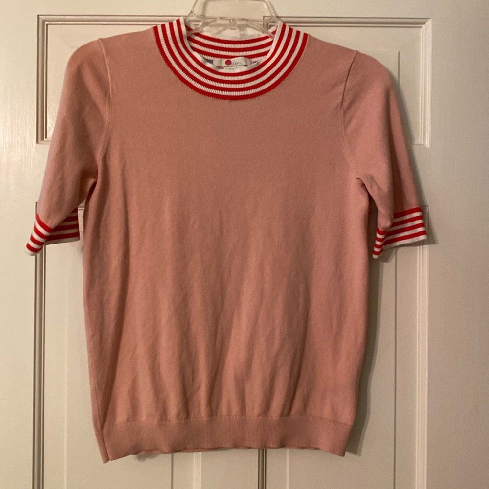 Boden pink sweater with red and white banded neck and sleeves. Size XS.
